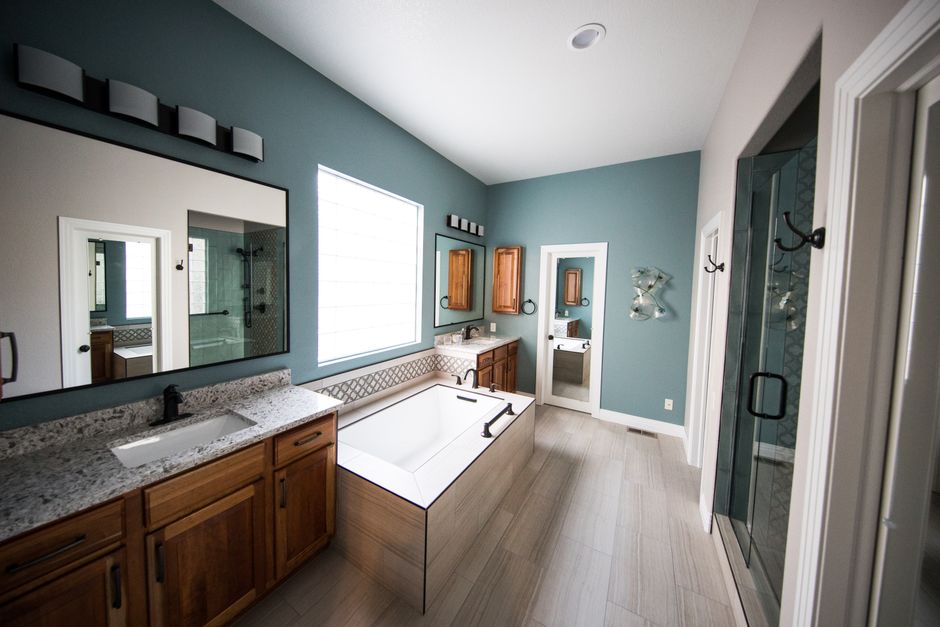 Professional bathroom remodeling contractor assessing a project space