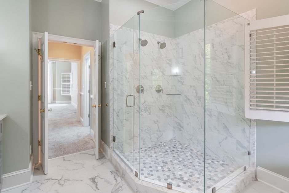 Elegant seamless glass shower door installation