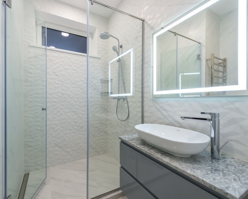 Modern elegant walk-in shower with premium fixtures